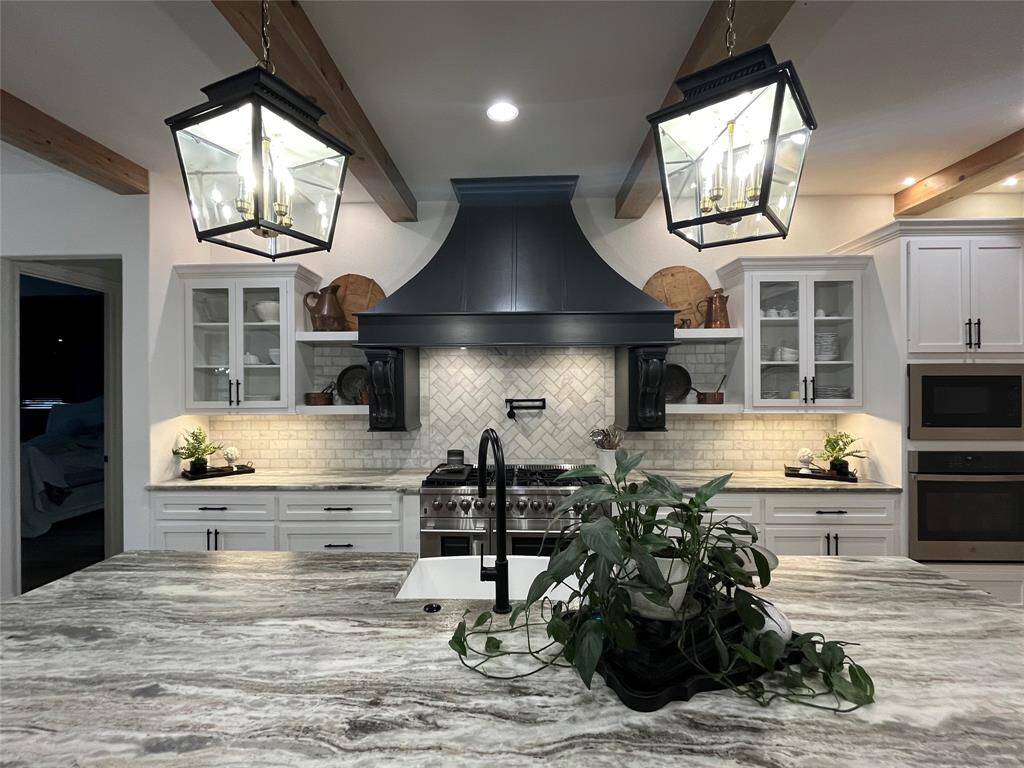 Custom cabinets and marble backsplash