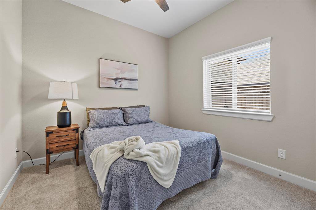 The third bedroom also has a fan and ample store space within the closet.