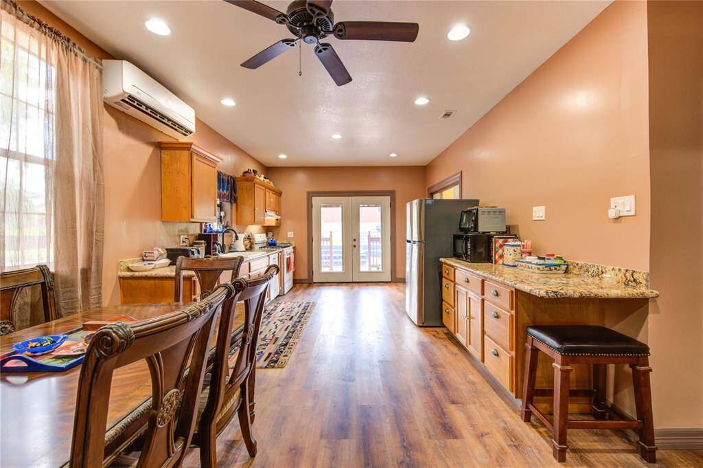 Kitchen features granite counter tops and gas cooking