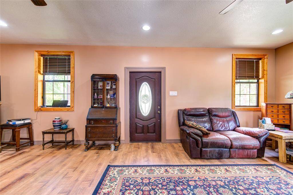 Front door leads to lovely covered porch for relaxing