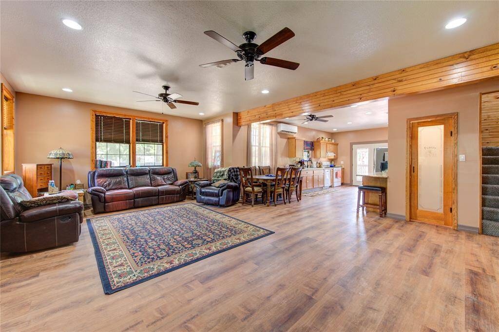 Open living,dining,and kitchen area. Walk in pantry under staircase.