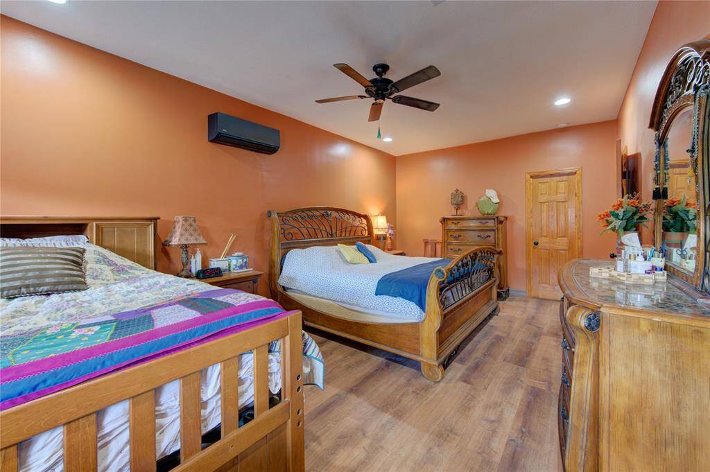 Another view of the primary bedroom