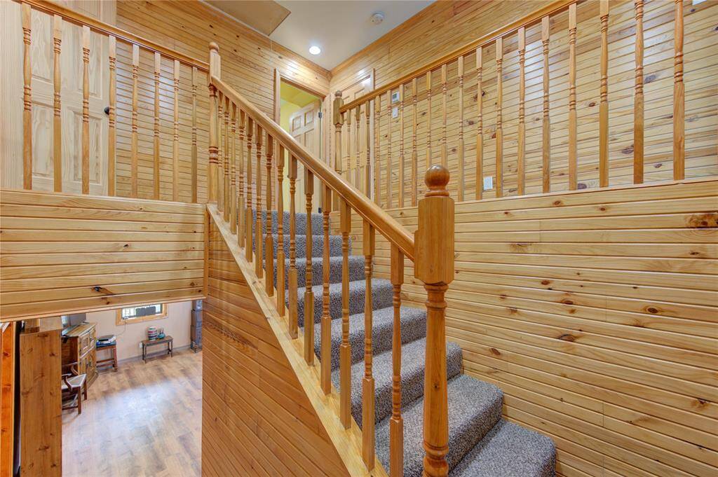 Lovely knotty pine stairway leading to 2nd floor