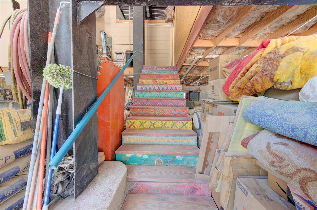 Colorful stairway from garage leads up to the upstairs apartment