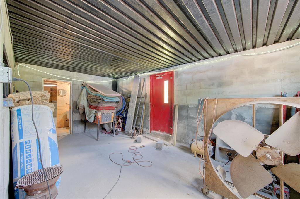 Office room, storage area, or safe room. Walls and ceiling are concrete adding protection from increment weather