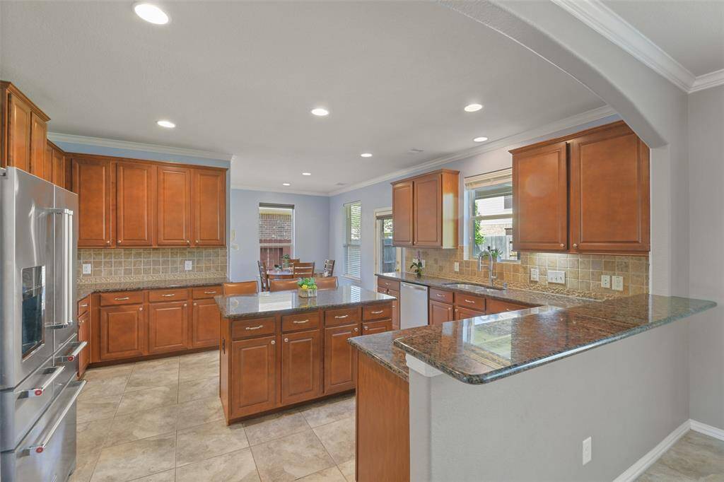 Open kitchen with plenty of cabinetry for storage