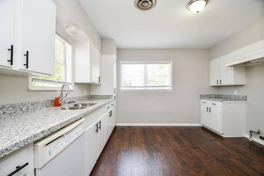 Kitchen is Open with lots of lighting, granite counter tops