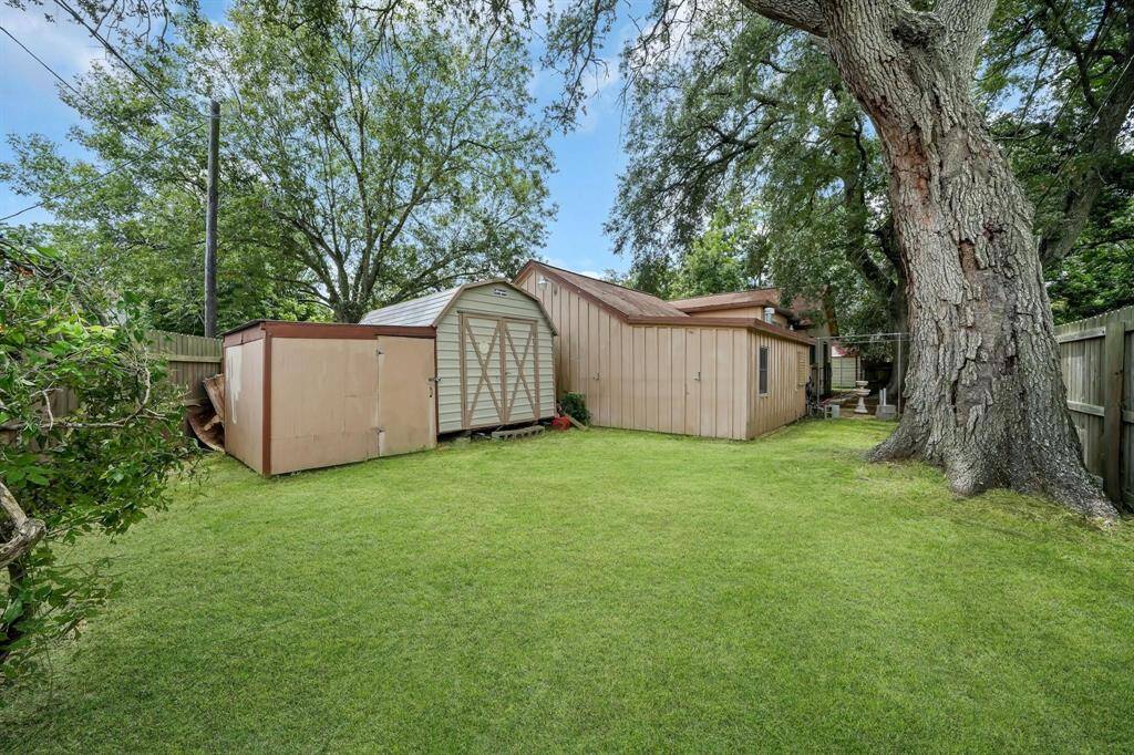 Large backyard with shed.