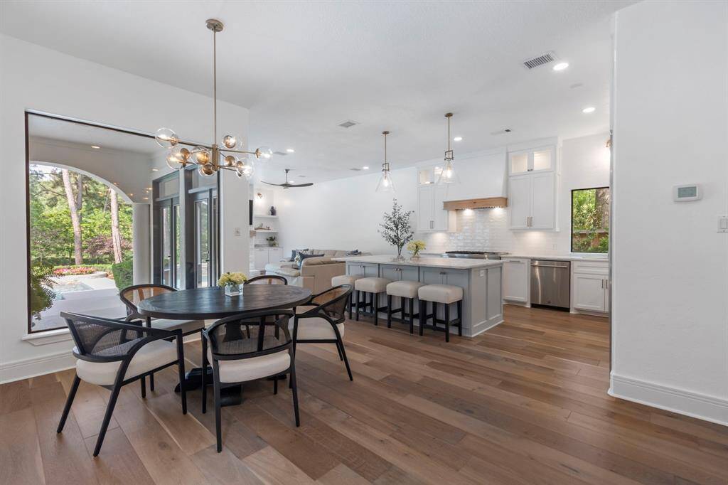 Adjacent to the kitchen, the breakfast area is perfectly situated for casual family meals.  Look at that view!
