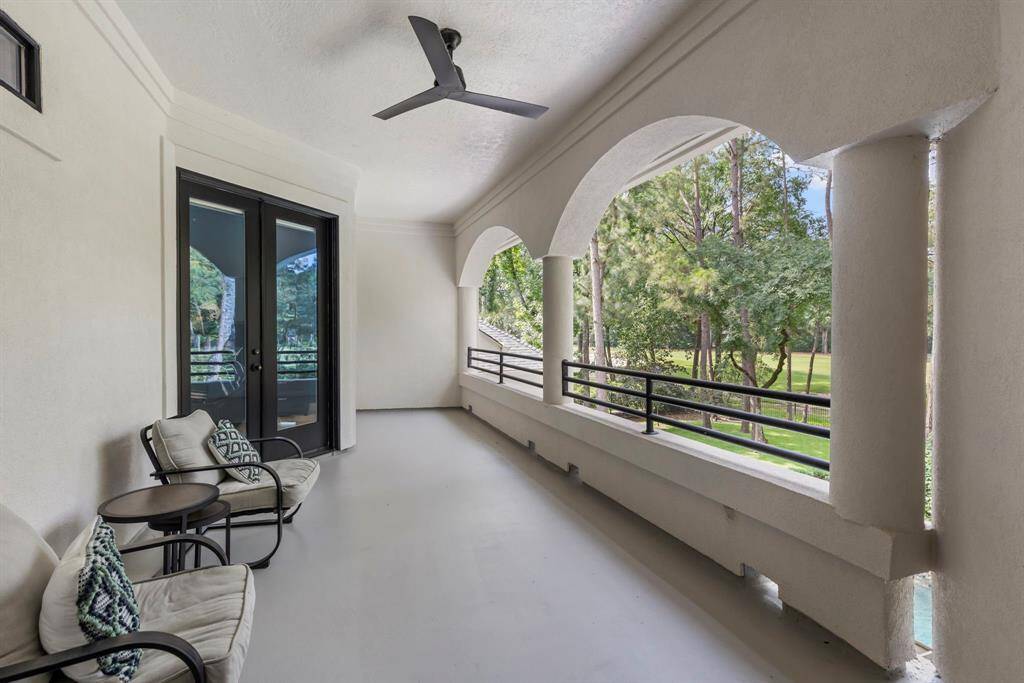 This expansive patio area offers sweeping views of the resort-style pool, lush landscaping, and golf course beyond—ideal for enjoying morning coffee, evening sunsets, or hosting guests.