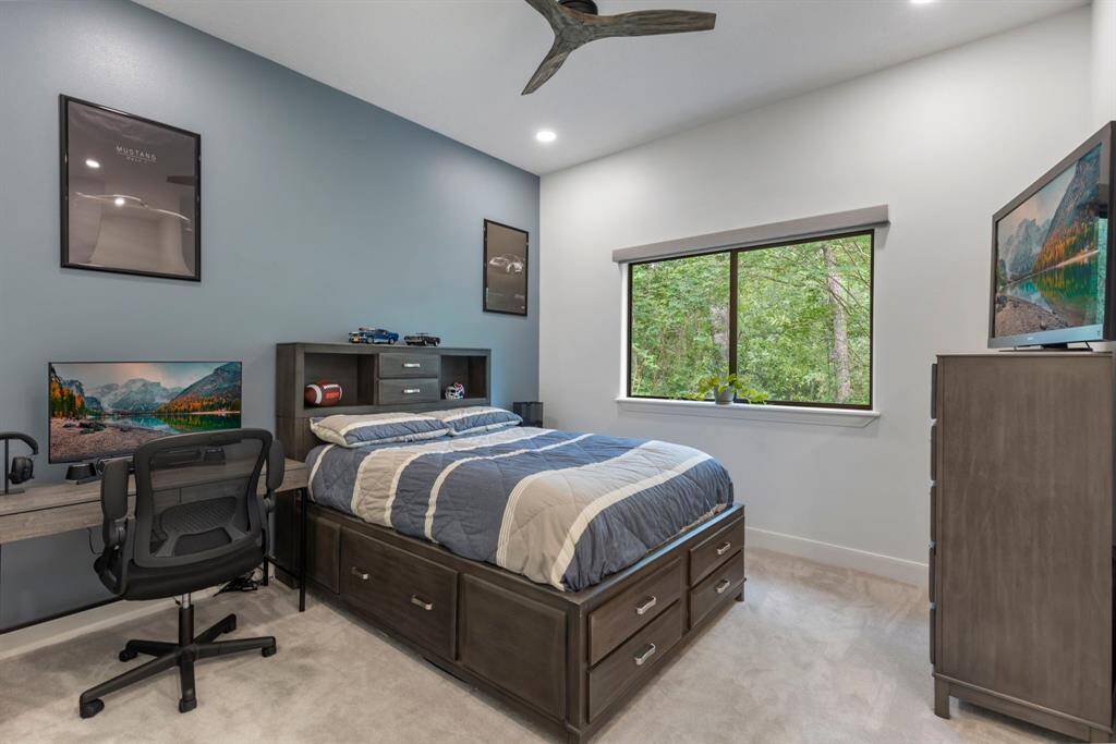 Secondary bedroom #2 has a large closet space and shares a full bath with secondary bedroom #3.  This bedroom has additional sound proofing.