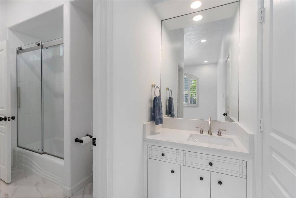 The wet area with shower/tub combination is shared, while primary bedroom #3 has their own vanity space as well.