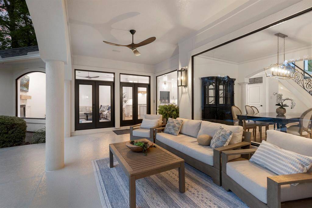 Fall in love with this backyard space - the generous covered patio features updated ceiling fans, gorgeous lighting and an unapparelled setting. Perfect for family gatherings or quiet evenings, this area is designed for both luxury and leisure.