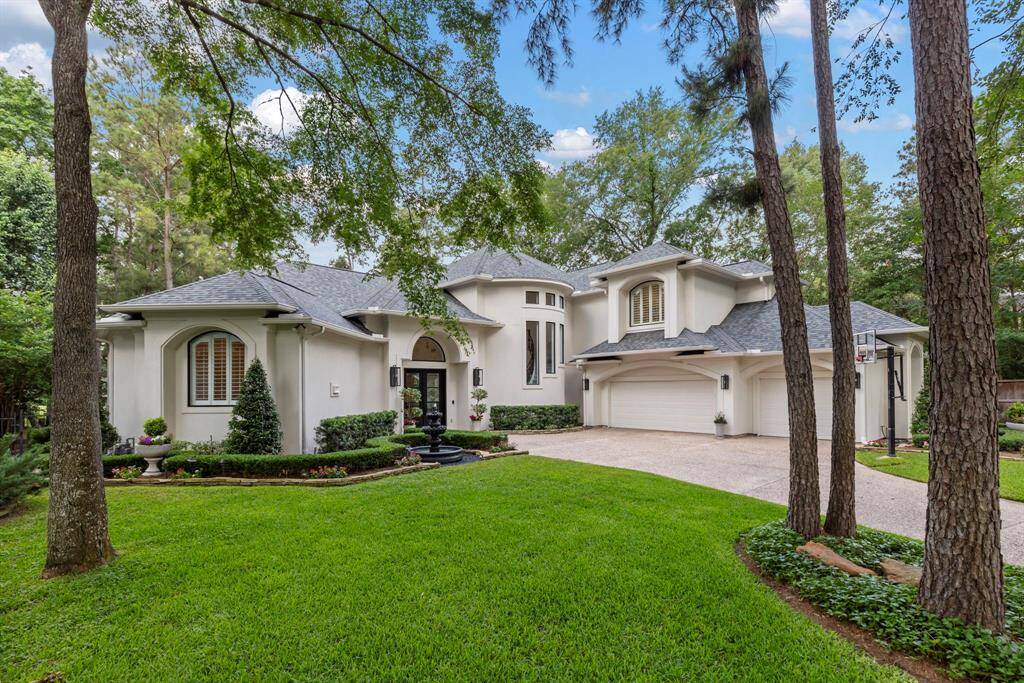 This stately luxury home offers exceptional curb appeal with fresh stucco and exterior paint (2020), situated on a prominent corner lot surrounded by lush green grass, a full sprinkler system, and precisely maintained professional landscaping. Raised flower beds framed by stacked flagstone and Anthology exterior lighting creates a striking first impression.