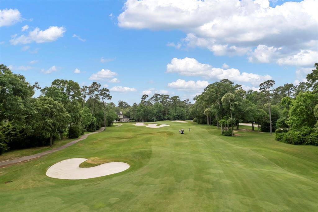 The home overlooks the fairway of The Palmer Course hole #6 at The Woodlands Country Club's "Deacon" course. This par 4 dogleg left is opposite of the golf cart path - offering privacy with a view!