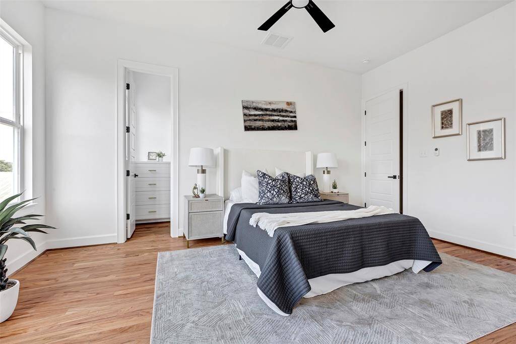 Make this main bedroom your own! Featuring plenty of space to personalize, along with a convenient walk-in closet for all your storage needs. (Model unit at 1234 E 23rd St. Design and finishes may vary)