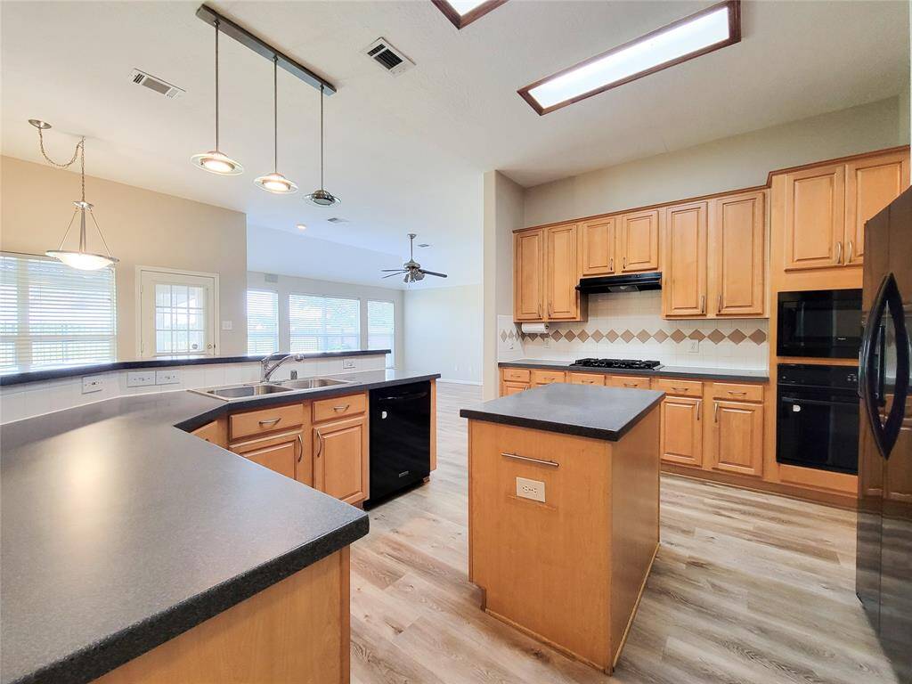 Awesome Kitchen with island & ton of cabinet & counter space.