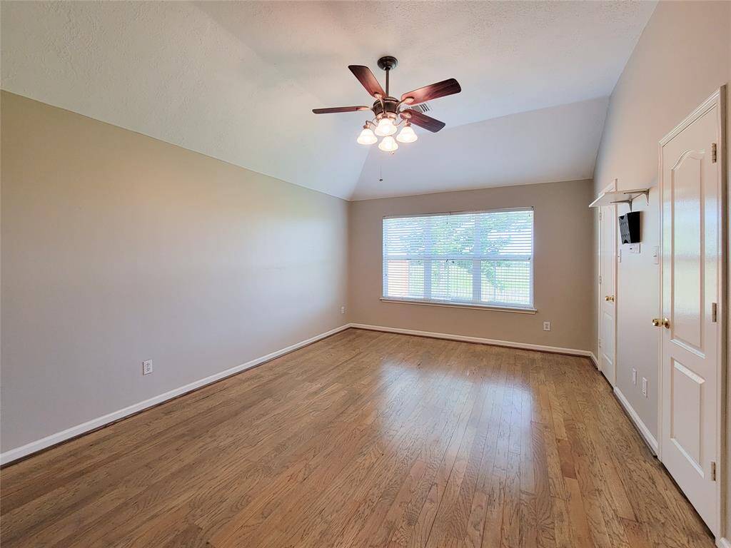 Primary Bedroom with Hardwood floor.