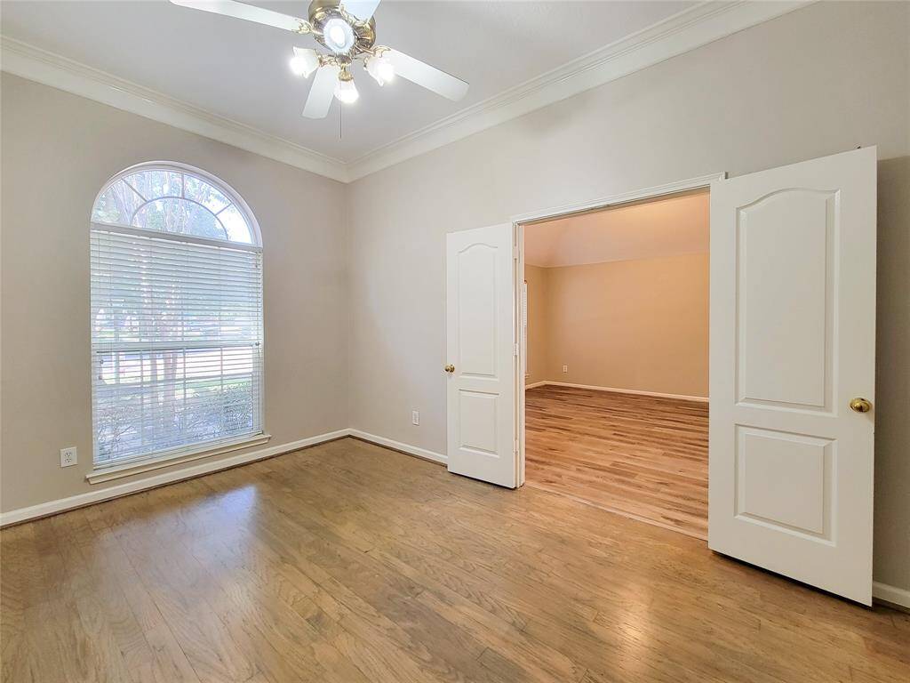 4th Room or Study with hardwood floor & crown molding.