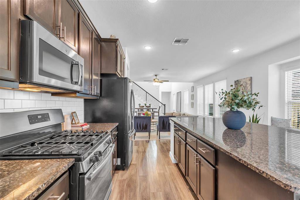 The open kitchen layout flows effortlessly into the living room.