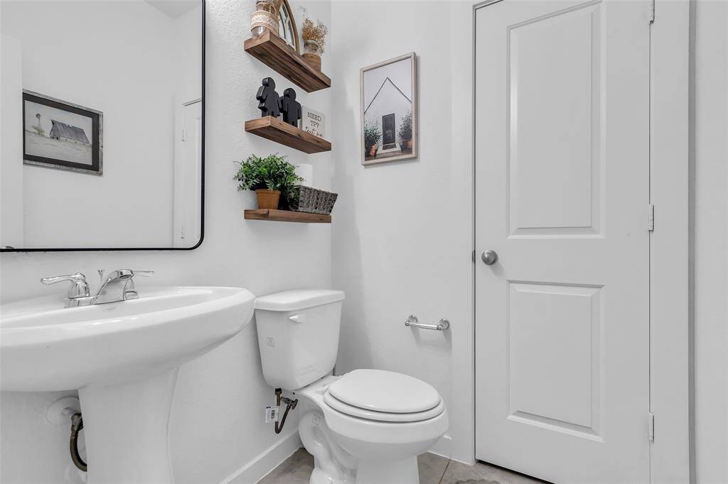 Powder room is located off of the living room downstairs.