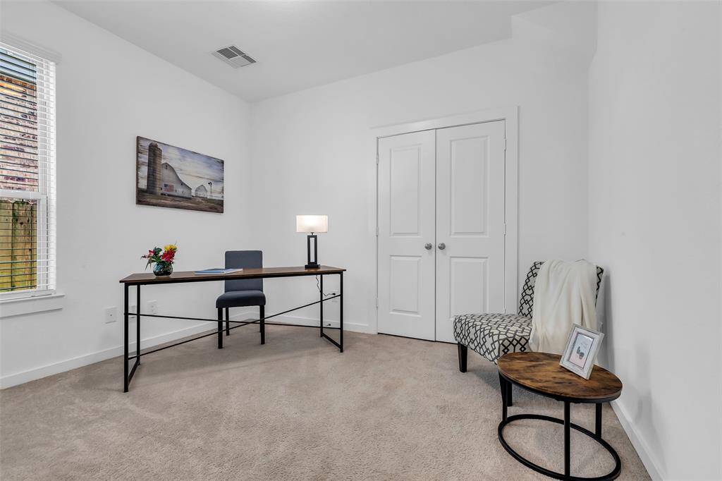 The downstairs home office offers flexibility with its own closet, making it ideal for use as a guest room, nursery, or additional bedroom if needed.