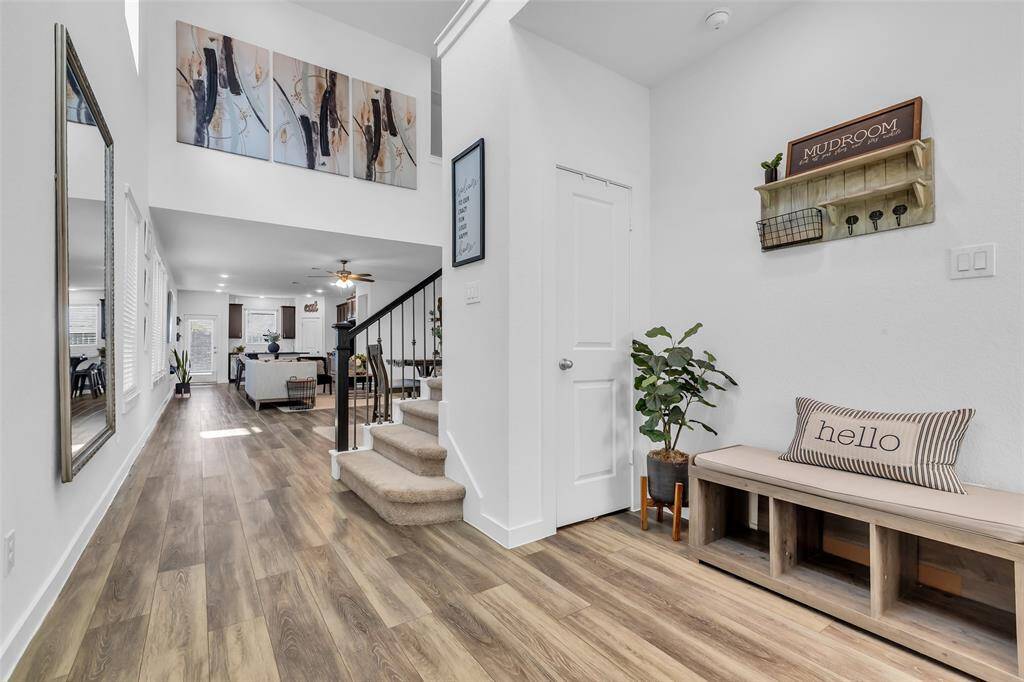 Spacious entryway with coat closet, laundry room in the front of the home, and attached 2 car garage.