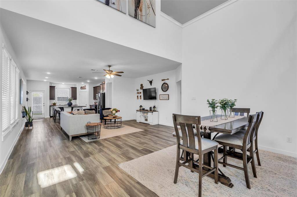 This stunning home showcases a spacious, thoughtfully designed layout with luxury vinyl flooring and an open-concept design that seamlessly connects the main living areas.