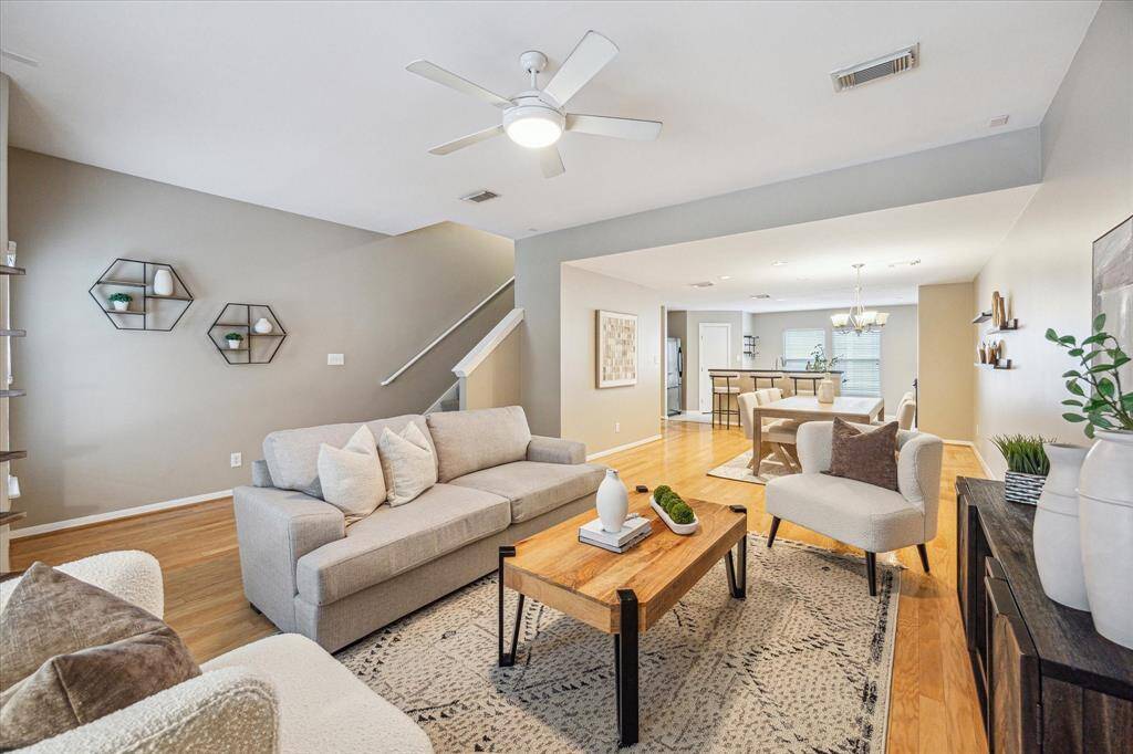 This spacious second-floor living area flows seamlessly into the dining room and kitchen, creating an open-concept layout perfect for both relaxed everyday living and effortless entertaining with family and friends.