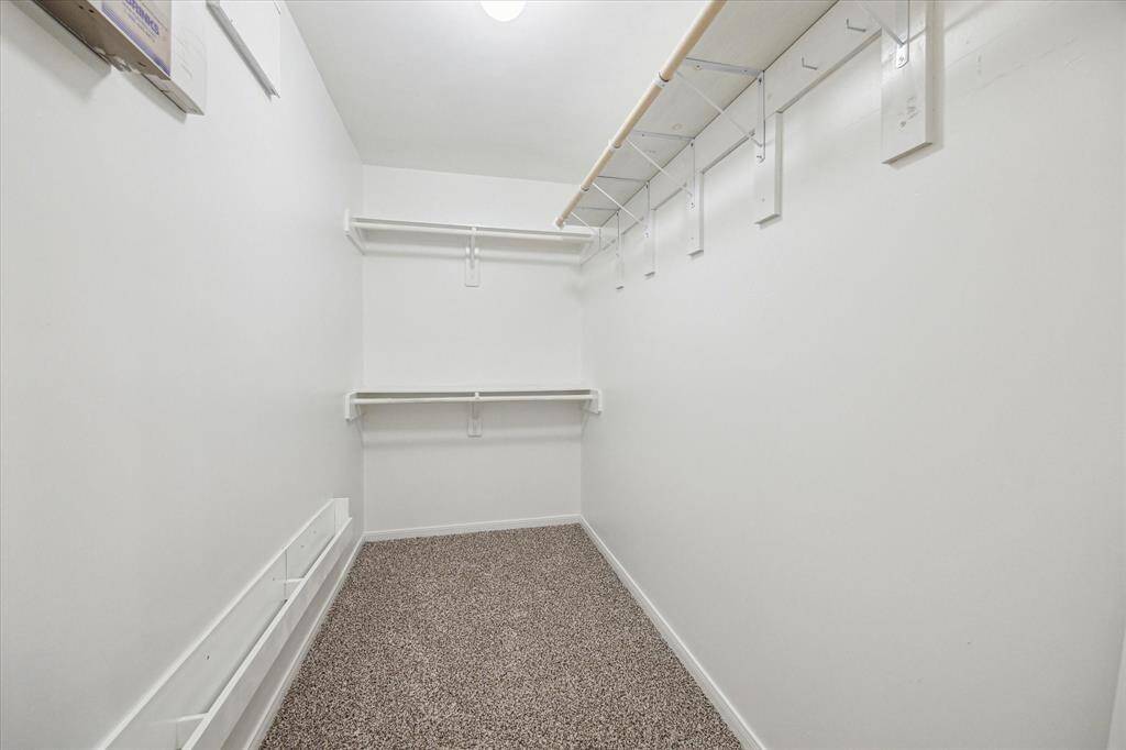 Shop until you drop! This deep walk-in closet can take it.
