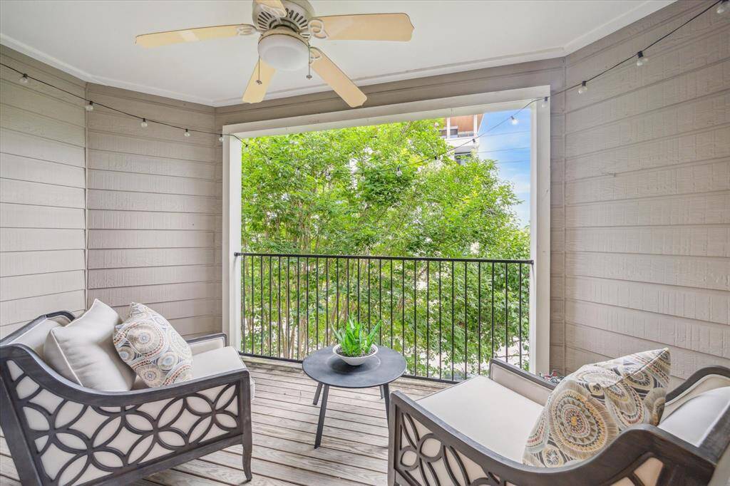Step out onto your private third-floor balcony, an ideal spot to enjoy a morning coffee, unwind with a book, or simply take in the fresh air. With a ceiling fan overhead and peaceful treetop views, this cozy outdoor retreat is yours to enjoy year-round.