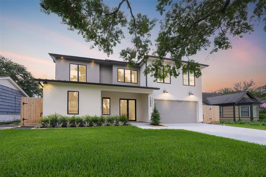 Big Oak Tree draws the attention to this stunning home