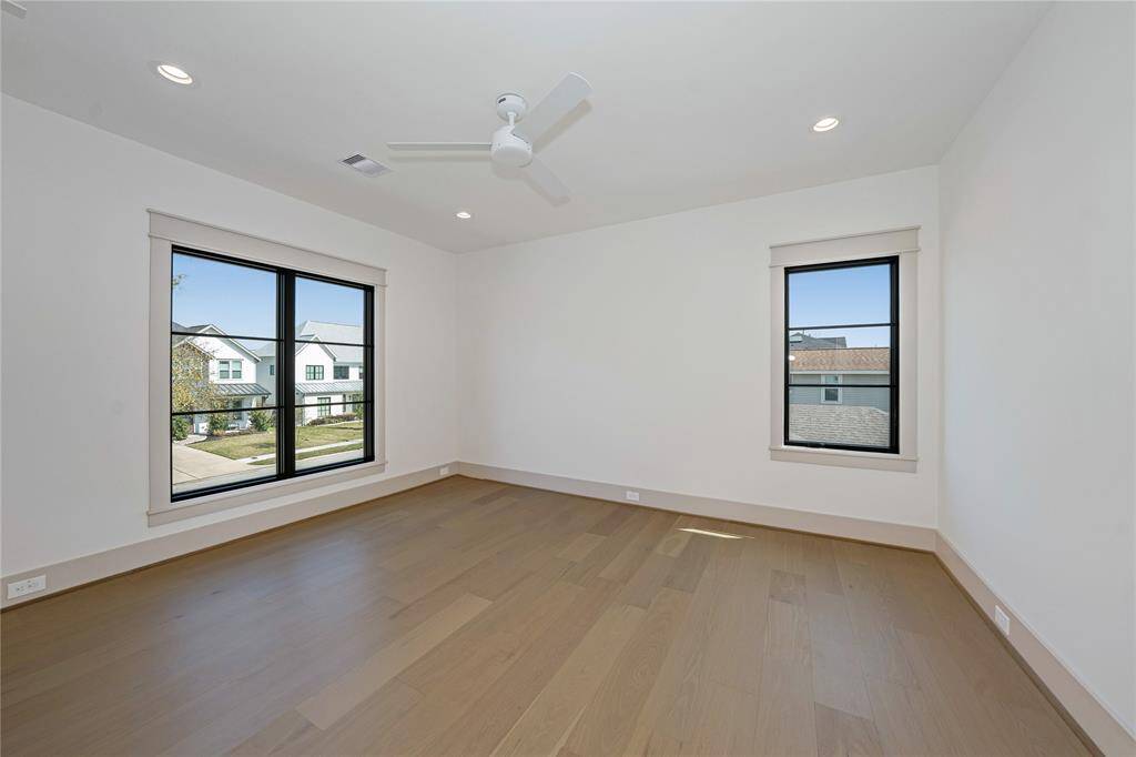 Bedrooms with hardwood floors and modern fans