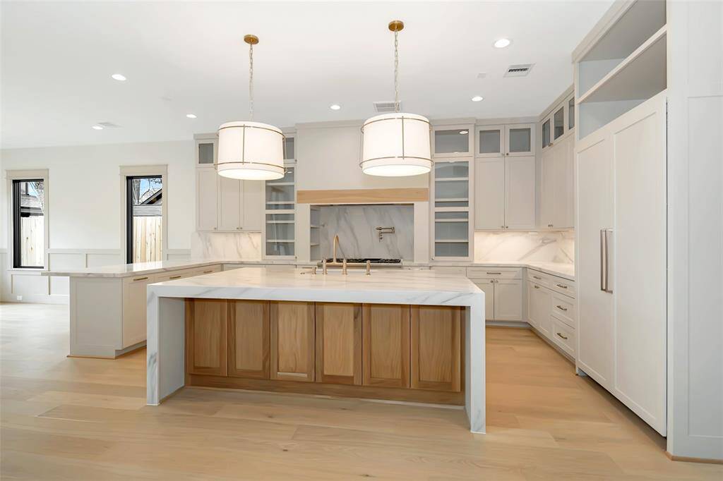 Elegant kitchen with warm finishes throughout.