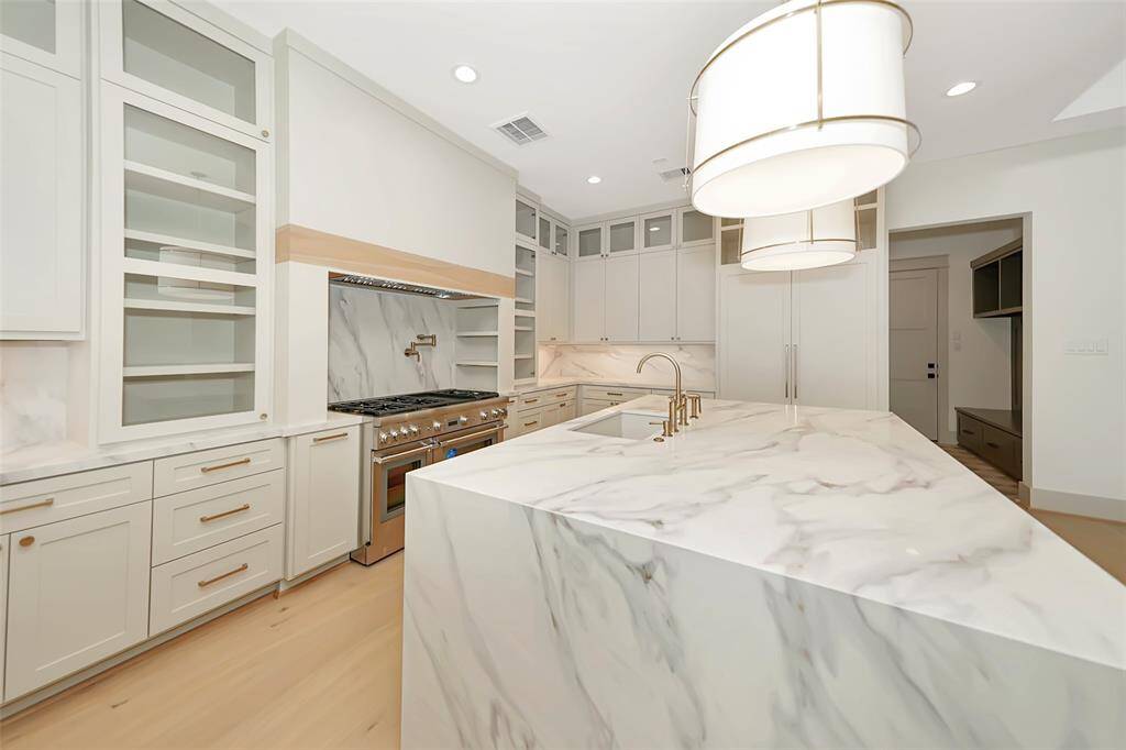 Quartz waterfall island and countertop backsplash