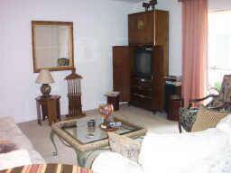The den has patio doors to huge balcony/storage