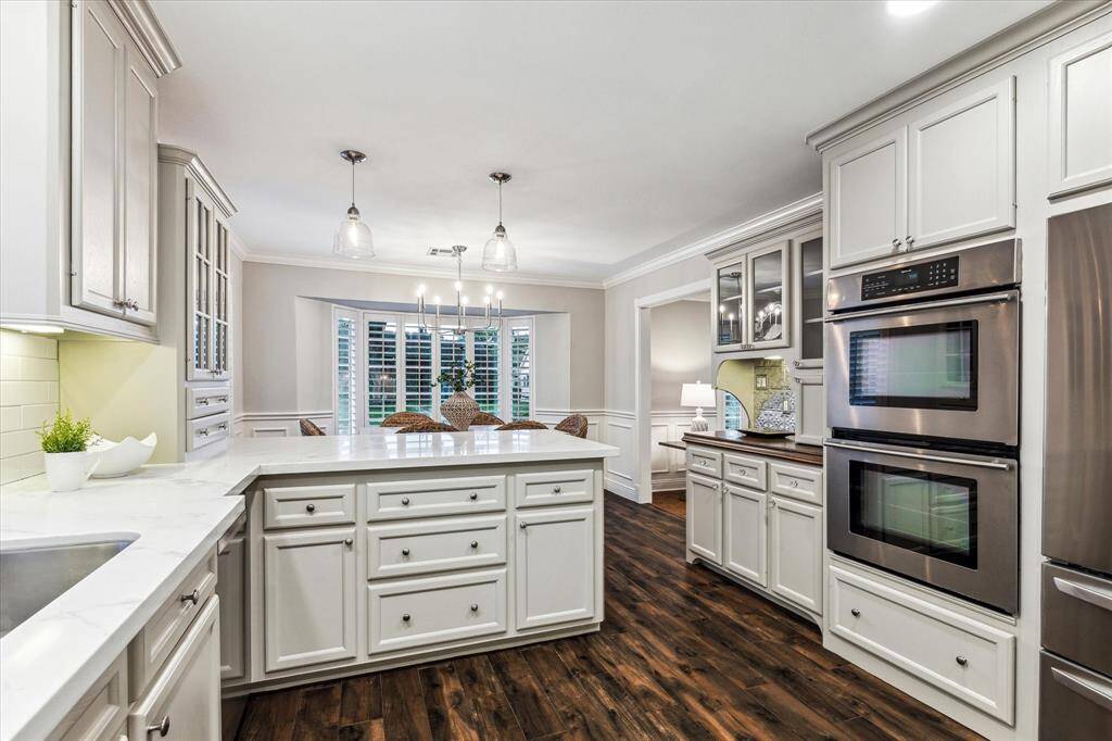 Designed for both style and function, the kitchen offers plenty of storage with custom-built cabinetry.