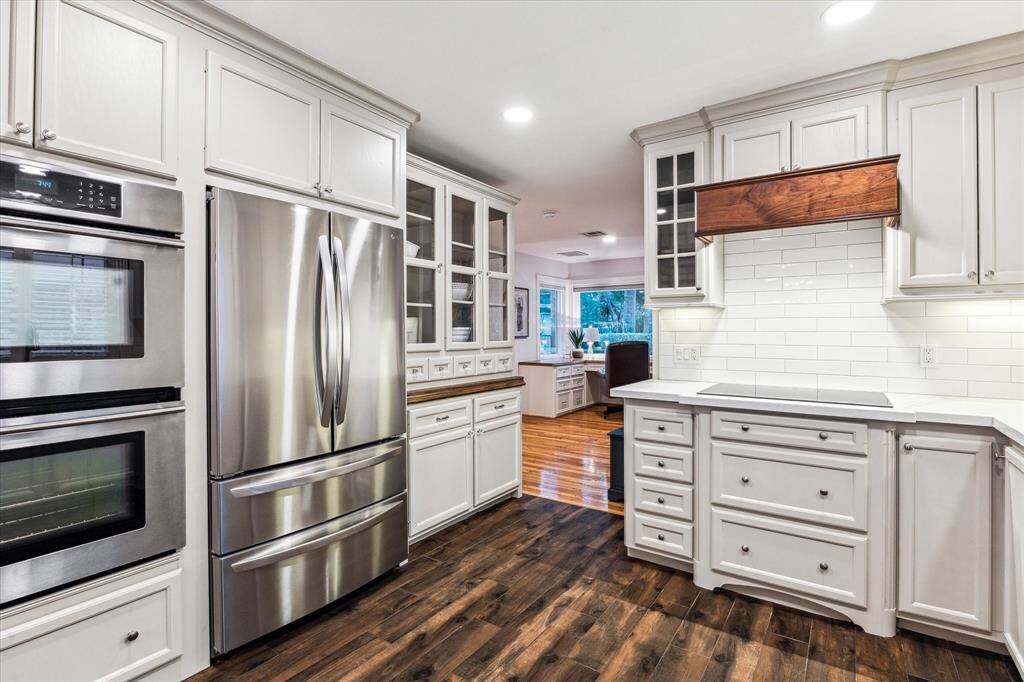 Spacious kitchen with ample pantry storage conveniently located nearby.