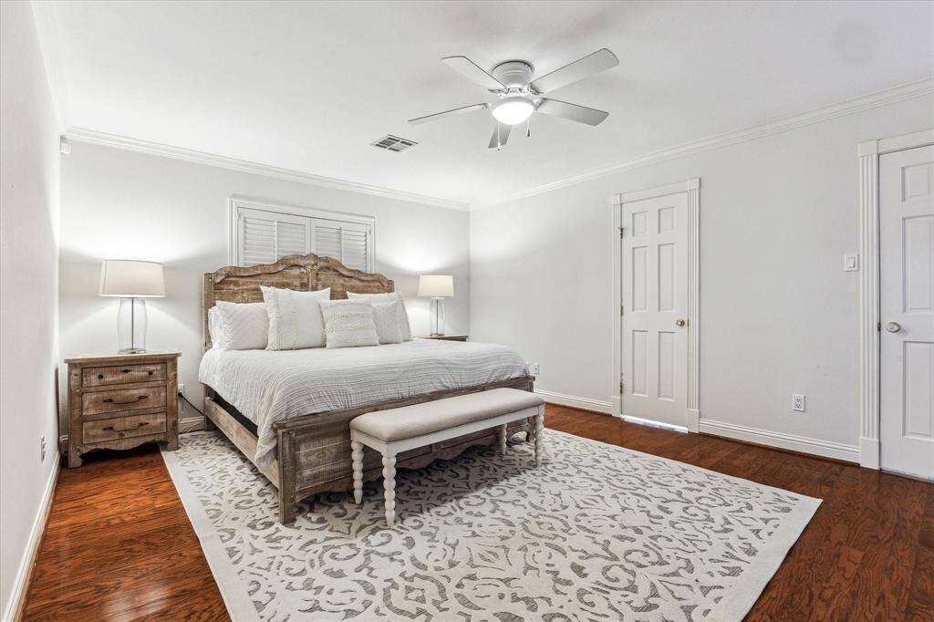 The primary suite offers a generous walk-in closet and a luxurious ensuite bathroom, creating a serene retreat within the home.