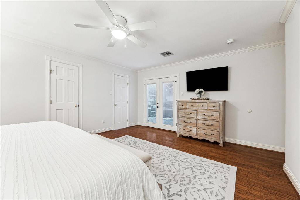 Direct access to the backyard from the primary bedroom enhances indoor-outdoor living.