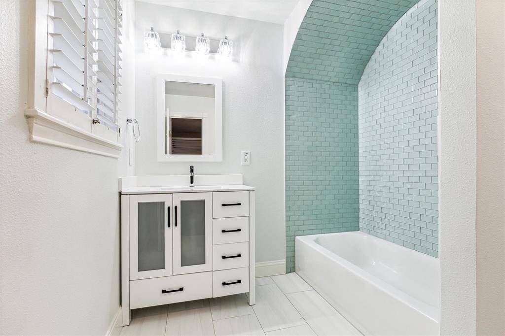 Spacious bedroom featuring a private ensuite bathroom for added comfort and convenience.