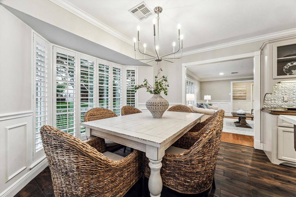 Opens to both the formal living room and kitchen for easy flow.