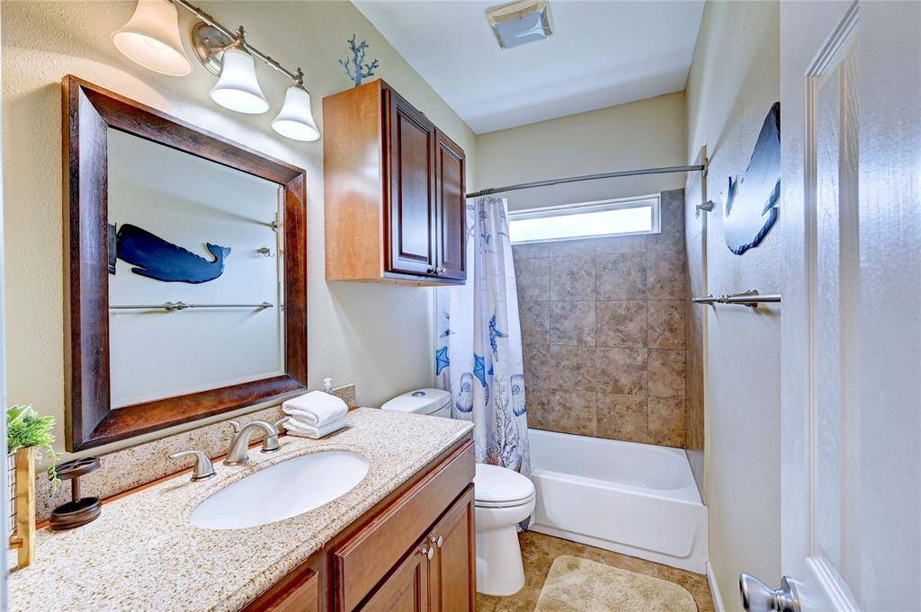 Downstairs guest bath serves guests and two bedrooms down.