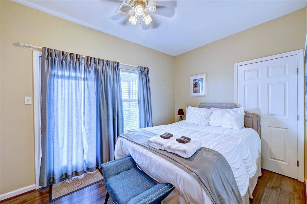 Front bedroom with en suite bath and a private balcony.