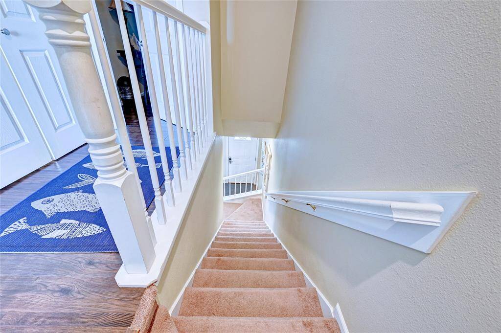 heading back downstairs passed the laundry closet on the left.