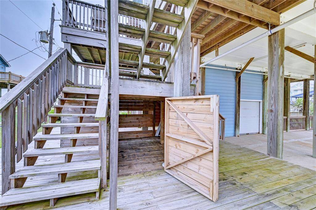 Large storage room under rear stairs.