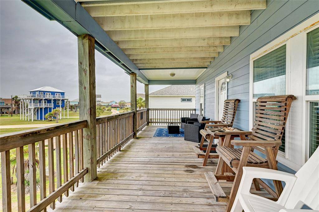 At the top of the stairs is a fantastic, deep covered porch, perfect to admire sunsets over the Bay or Gulf Views to the SW.