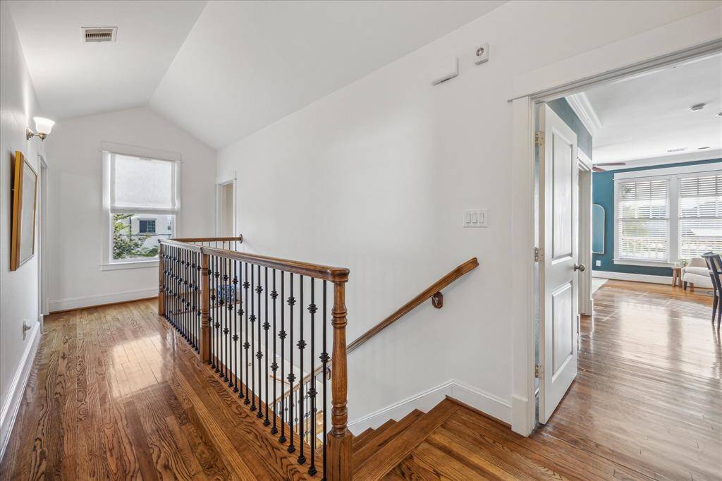 Gracious hallway upstairs. Note the custom window shade.