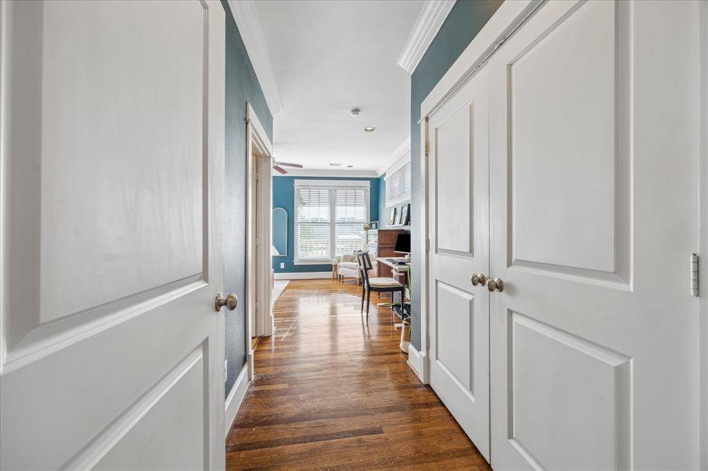 Entry to the primary suite. One of two large closets to the right. Ensuite bath is to the left.