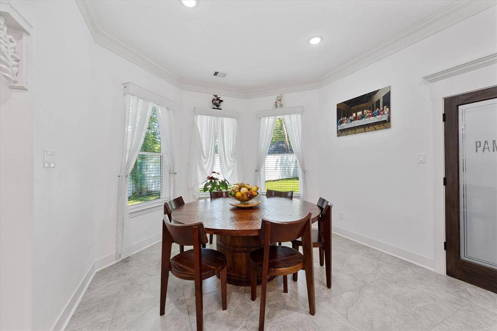 These windows in the breakfast nook overlook this peaceful backyard.